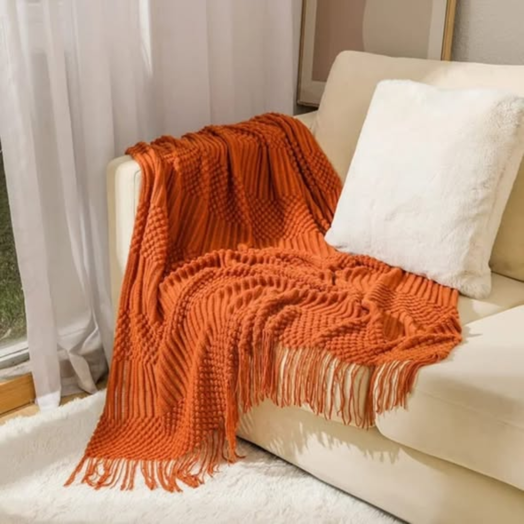 Knitted throw blanket with tassels