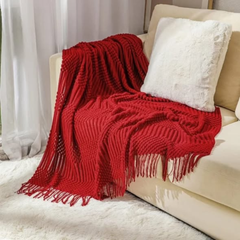 Knitted throw blanket with tassels