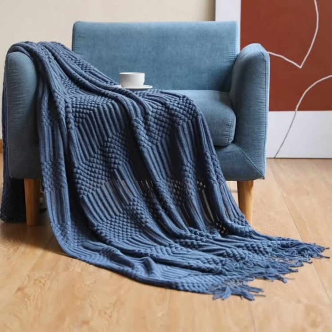 Knitted throw blanket with tassels