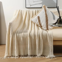 Knitted throw blanket with tassels