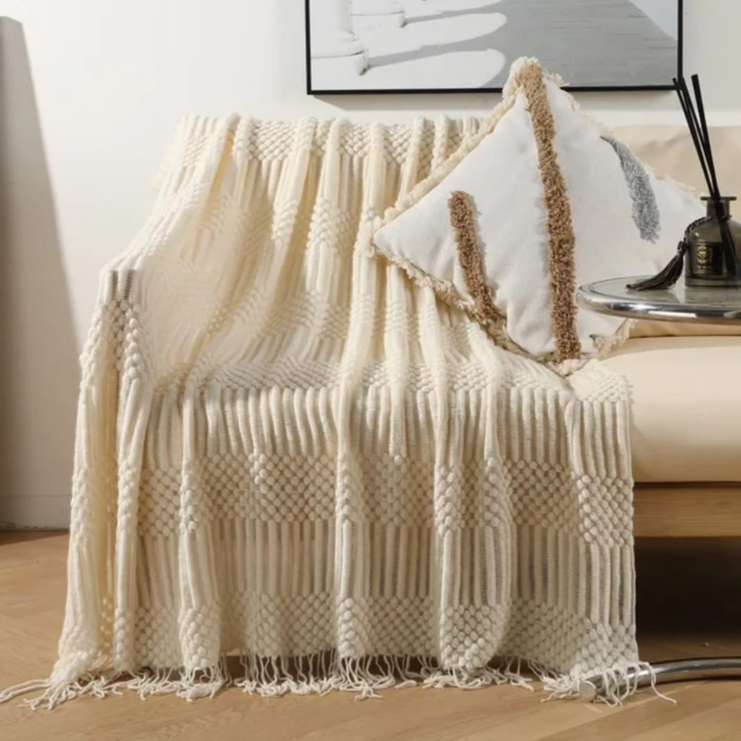 Knitted throw blanket with tassels