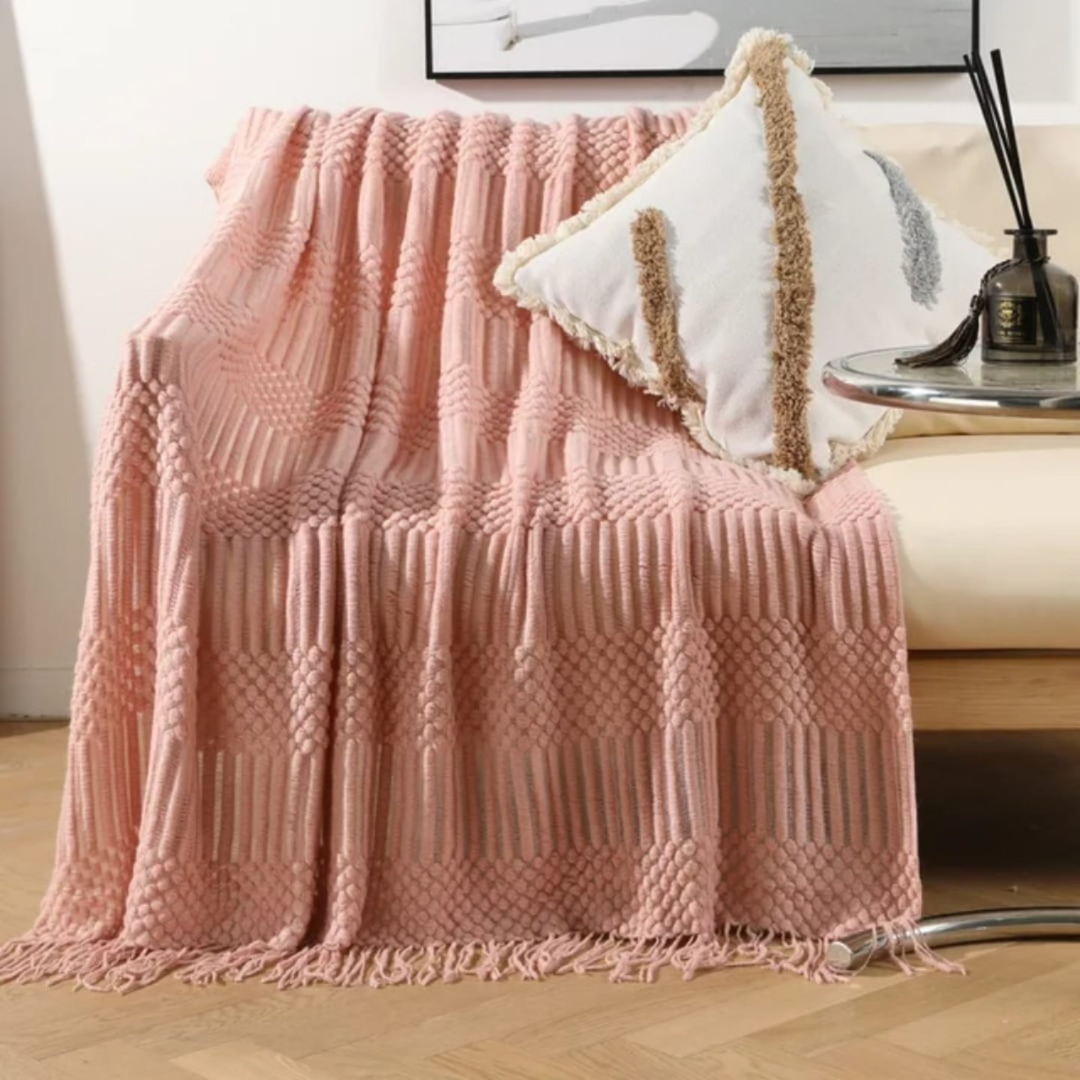 Knitted throw blanket with tassels
